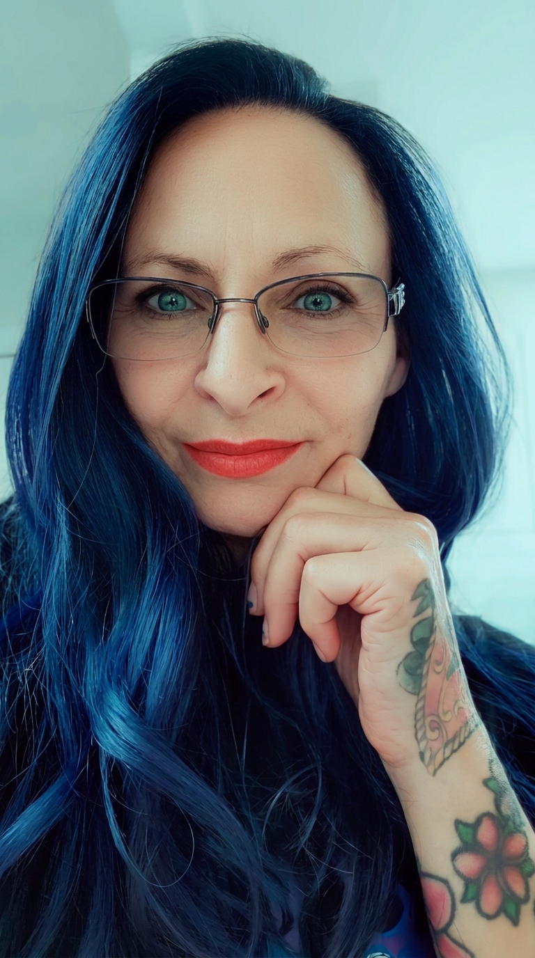 Friendly portrait of Corrina Herman, owner of Sweeping Beauty